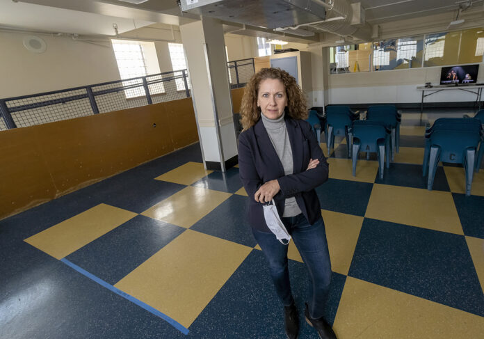 KAREN A. SANTILLI, CEO and president of Crossroads Rhode Island, is excited about the $500,000 pledge that High Rock Development LLC promised to the nonprofit as part of the 'Superman' building renovation project. But, she hopes the developers will honor that pledge. PBN FILE PHOTO/MICHAEL SALERNO