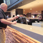 RISKING IT: A customer receives a betting ticket in the sports betting lounge at the Tropicana casino in Atlantic City, N.J., recently. American gamblers have wagered over $125 billion on sports with legal betting outlets in the four years since the U.S. Supreme Court cleared the way for states to offer legal sports betting.  / AP PHOTO/WAYNE PARRY
