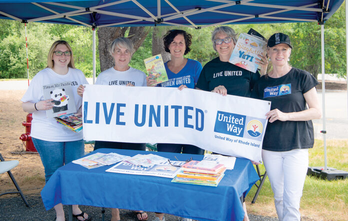 GOOD READING: United Way of Rhode Island Inc. employees attend a recent outdoor event to promote reading for children. / COURTESY UNITED WAY OF RHODE ISLAND INC.