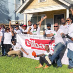 TEAMWORK: Gilbane Building Co. employees partner with nonprofit Rebuilding Together on a community service project. / COURTESY GILBANE BUILDING CO.