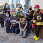GAME ON: Employees with University Orthopedics Inc. dress up in their favorite sports attire in the office. / COURTESY UNIVERSITY ORTHOPEDICS INC.