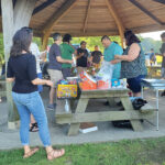 BIG SPREAD: Envision Technology Advisors LLC employees gather for a recent company picnic.  COURTESY ENVISION TECHNOLOGY ADVISORS LLC