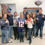 PATRIOTS PRIDE: Employees at Secure Future Tech Solutions wear New England Patriots attire as part of the company’s Patriots Spirit Day.  COURTESY SECURE FUTURE TECH SOLUTIONS