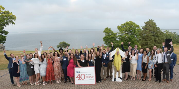 THE 2022 HONOREES of Providence Business News' 40 Under Forty Awards program pose during Thursday's event at Aldrich Mansion in Warwick. / PBN PHOTO/MIKE SKORSKI