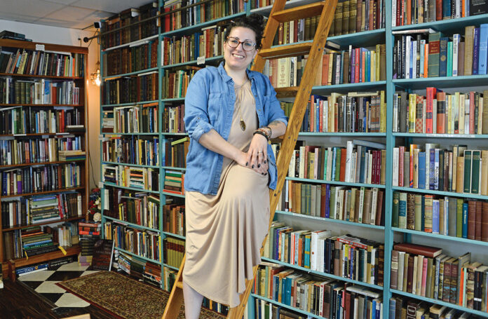 FROM PASSION TO PROFESSION: Kelly Allen-Kujawski used her love of reading to launch Rarities Books & Bindery in South Kingstown, where she specializes in restoration and preservation services for antique books and documents.  PBN PHOTO/ELIZABETH GRAHAM