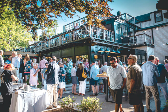 GRAND OPENING: People gather at the newly opened Beech restaurant in Jamestown in June. Beech replaces the former Simpatico Jamestown restaurant on Narragansett Avenue, which was bought by restaurateur Kevin Gaudreau, renovated and reopened under the new name.  COURTESY BEECH/KEITH MERLUZZO