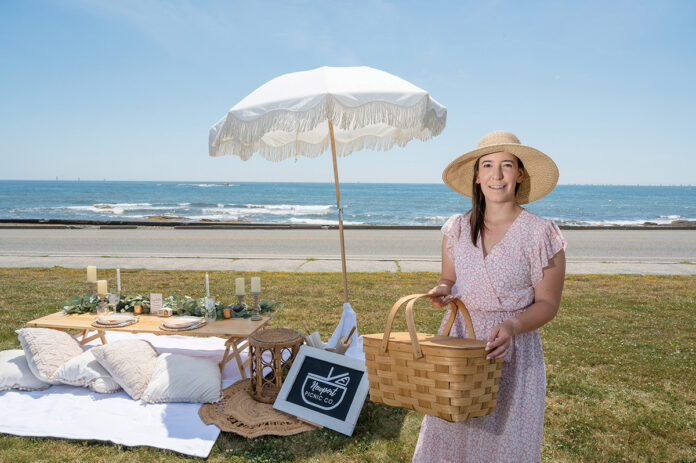 PICNIC PREP: Newport Picnic Co. owner Hollie Mitchell prepares one of her pop-up picnics at Brenton Point State Park in Newport.  PBN PHOTO/DAVID HANSEN