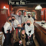 BOB BURKE, back row at left, owner of Pot au Feu Restaurant in Providence, says that while local restaurants are back to being full after the COVID-19 pandemic impacted operations, the costs for restaurants to operate has risen due to inflation and supply chain problems. / COURTESY POT AU FEU