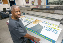 BUSY SEASON: Gary Wallace, owner of Hall of GraFX in Providence, has gotten all the work he can handle this election season printing banners, yard signs and stickers for political candidates. PBN FILE PHOTO/­MICHAEL SALERNO