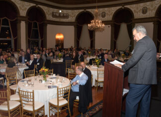 PROVIDENCE BUSINESS NEWS Editor Michael Mello, right, addresses the crowd Thursday during PBN's Fastest Growing & Innovative Companies Awards ceremony at the Graduate Providence. / PBN PHOTO/MIKE SKORSKI
