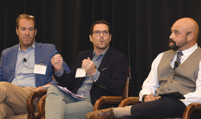 PUT TO THE TEST: Dr. Jonathan Martin, center, co-founder of PureVita Labs LLC, talks during a panel discussion at Providence Business News’ 2022 Business of Cannabis Summit on Sept. 15. PureVita offers regulatory testing for marijuana cultivators. Also on the panel are, from left, Seth Bock, founder and CEO of Greenleaf Compassionate Care Center Inc.; and Michael Budziszek, a professor of biological sciences at Johnson & Wales University. PBN PHOTOS/MIKE SKORSKI