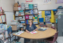 CRAMPED CLASSROOM: Thornton Elementary School Principal Louise Denham sits in one of the school’s cramped classrooms. The building is more than 100 years old and is part of a plan to consolidate all four elementary schools in Johnston using a voter-approved $215 million school construction bond.  PBN PHOTO/MICHAEL SALERNO  