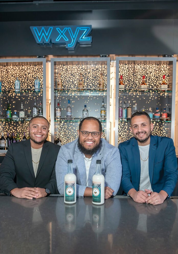 COQUITO CREW: Papis Refrescos LLC co-owners, from left, Travis Escobar, Victor Regino and Lewis Olmo run one of the only companies in Rhode Island making and selling coquito.  PBN PHOTO/MICHAEL SALERNO