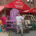 THE CHAIR MEN: Knock on Wood Furniture Inc. owner Michael Gordon, right, and his son Nathan Gordon, head of finishing operations, stand in front of the Lincoln furniture store and manufacturer.  PBN PHOTO/MICHAEL SALERNO