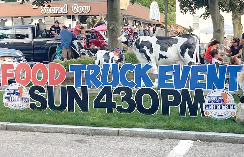 FAST FOOD: Attendees gather at A. B. Munroe Dairy Inc.’s Sacred Cow Scoop Shop & Market in East Providence on Sept. 4 for the Food Trucks and Sundaes event organized by Eric Weiner and his PVD Food Trucks Events clearinghouse.  COURTESY BEN NEWBURY