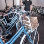 TYLER JUSTIN, owner of Mission Electric, sells and maintains electric bicycles. State officials announced Wednesday that it will launch the Erika Niedowski Memorial Electric Bike Rebate Program, which will offer residents reimbursements for purchasing e-bikes. /PBN FILE PHOTO/MICHAEL SALERNO