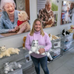 NEW BREED OF COMPANIONSHIP: Meghan Gamboa, Ageless Innovation LLC co-founder and senior vice president, holds an animatronic cat at the company’s Pawtucket headquarters. The cats, dogs and birds produced by Ageless Innovation have been shown to be beneficial for the mental health of the elderly. PBN PHOTO/ MICHAEL SALERNO