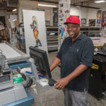 SEIZING THE MOMENT: After working as a technician in the printing business for more than a decade, Gary Wallace, owner of Hall of GraFX in Providence, jumped at the chance to start his own print shop when one of his customers decided to retire and Wallace purchased his printing equipment for $12,000. PBN PHOTO/MICHAEL SALERNO