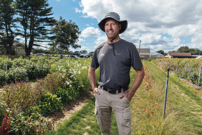 FULFILLED FARMER: Christopher Clegg, a fifth-generation co-owner of his family’s Four Town Farm in Seekonk, used to dream of being an architect until he decided to step up to continue running the family business, a job he now relishes and is passionate about.  PBN PHOTO/RUPERT WHITELEY