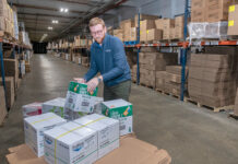 BUILDING BLOCKS: Ryan Powers, co-owner of RJP Packaging LLC, works at the company’s Pawtucket headquarters. Powers and his father, John Powers, started the business as an industrial packaging company but have expanded. PBN PHOTO/MICHAEL SALERNO