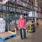 TAKING STOCK: Rhode Island Community Food Bank Chief Philanthropy Officer Lisa Roth Blackman says empty shelves are a common sight at the organization’s Providence warehouse because demand is so high lately.  PBN PHOTO/MICHAEL SALERNO