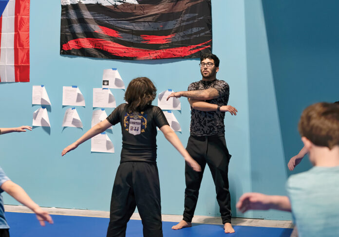 HITTING HIS GOAL: Nic Cortes, owner of Cortes BJJ LLC, leads one of the classes at his jiu-jitsu studio in Warwick, which offers self-defense programs, fitness and strength conditioning. Cortes realized his dream of starting his own academy when he opened his studio in 2017. PBN PHOTO/MICHAEL SALERNO