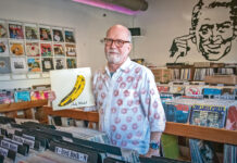 RARE FIND: In Your Ear Records owner Chris Zingg holds a 1967 pressing of “The Velvet Underground & Nico” at the record store’s recently opened second location in Warren at 99 Water St., which specializes in rarities and high-end records. PBN PHOTO/MICHAEL SALERNO