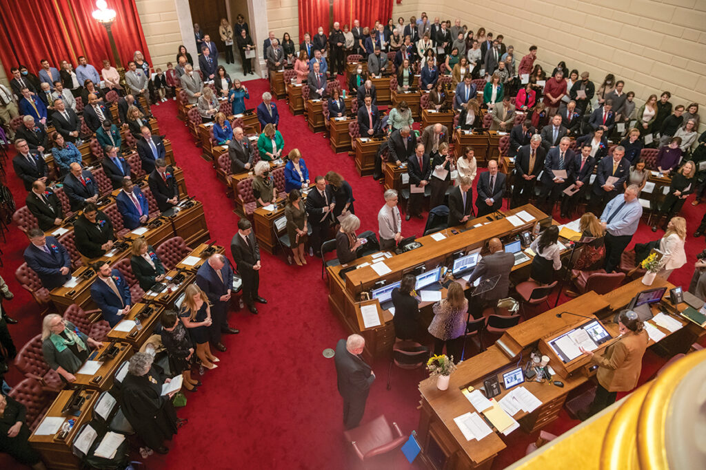 STANDING ROOM ONLY: State representatives open the 2023 legislative session in the House chambers on Jan. 3. For the second year in a row, lawmakers begin their work as the state is projecting a massive surplus for the current fiscal year.  PBN PHOTO/ MICHAEL SALERNO