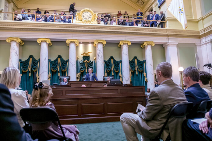 RETURN TO THE ROSTRUM: Senate President Dominick J. Ruggerio takes his place at the front of the Senate chambers on Jan. 3, the first day of the 2023 General Assembly session. It’s a position Ruggerio has held since 2017.  PBN PHOTO/MICHAEL SALERNO