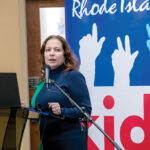 HELP WANTED: R.I. Education Commissioner Angélica Infante-Green, pictured speaking at a Rhode Island Kids Count event in January, has asked for assistance from the business community to improve Providence’s struggling schools.  PBN PHOTO/MICHAEL SALERNO