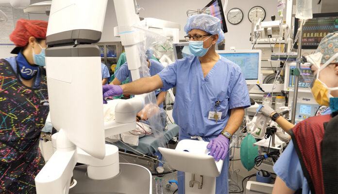 HONING IN: Dr. Abbas El-Sayed Abbas, chief of thoracic surgery at Lifespan Corp., uses the Ion machine, a robotic-assisted navigational bronchoscopy system at Rhode Island Hospital that allows doctors to perform biopsies on small lung nodules. COURTESY  BROWN SURGICAL ASSOCIATES