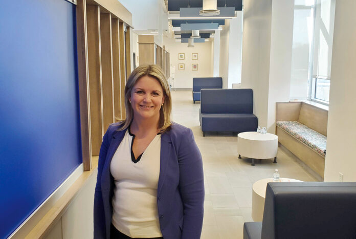 PREPPING FOR CHANGE: Lindsay Lang, director of HealthSource RI, says the organization is taking steps to ease the change in health care coverage for the hundreds of people who will no longer be eligible for Medicare.  PBN PHOTO/­­CLAUDIA CHIAPPA