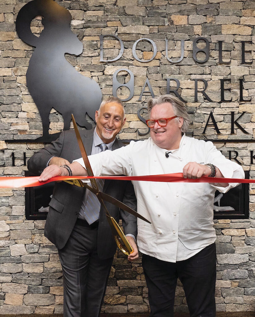 GRAND OPENING: Paul Mihailides, left, chairman of the Preserve Sporting Club & Residences in Richmond, and David Burke, executive chef of Double Barrel Steak by David Burke, cut the ribbon on the new restaurant, which opened at the Preserve on March 1.  COURTESY PRESERVE SPORTING CLUB & RESIDENCES 