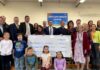 STATE AND EDUCATION OFFICIALS present a grant to Warwick Schools at Oakland Beach Elementary School. The state has awarded 21 grants to local education agencies and nonprofit partners totaling $3.9 million. / COURTESY GOV. DANIEL J. MCKEE