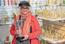 REWARDING JOB: Kristen Gossler, president of American Trophy and Supply Inc., has expanded the business with her husband, Peter Cameron, since buying it from her parents in 1990.  PBN FILE PHOTO/MICHAEL SALERNO