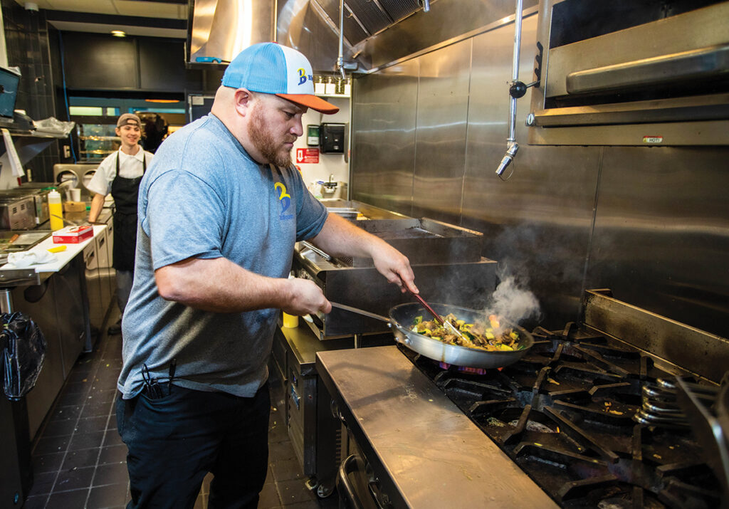 IN DEMAND: Benny Barber, executive chef of Hope & Main’s Downtown Makers Marketplace in Providence, had a hit with his grilled cheese sandwich and signature roasted garlic onion jam at the opening of the Schoolyard Market in Warren on June 14. COURTESY ERIN X. SMITHERS PHOTOGRAPHY